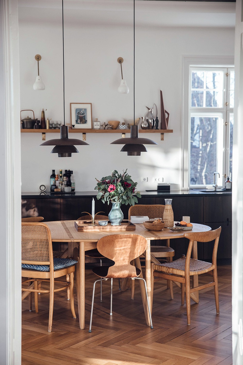 hardwood kitchen flooring in modern space with dark wood cabinets and open shelving