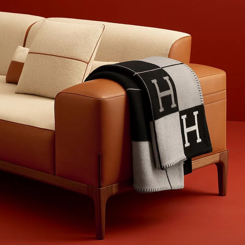 hermès throw draped on leather sofa