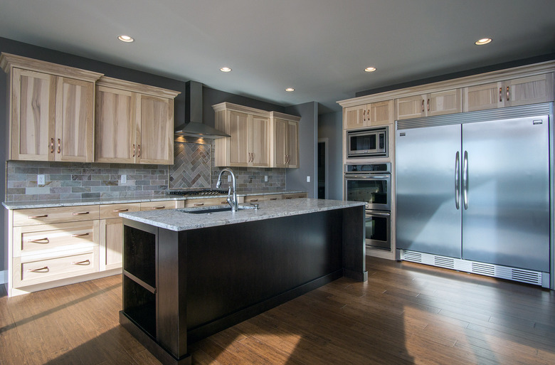 kitchen space with light hickory cabinets