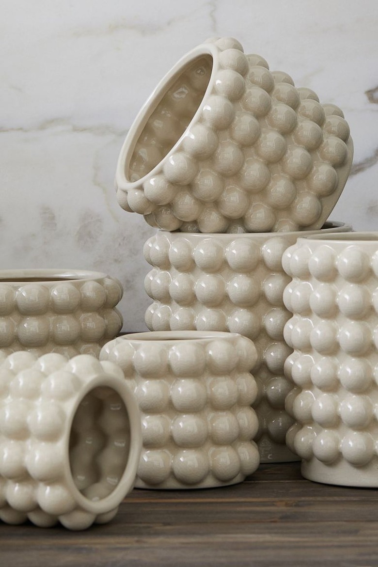 Stack of white plant pots