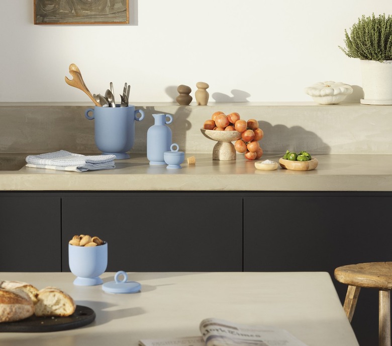 A kitchen with blue ceramic bowls and vases