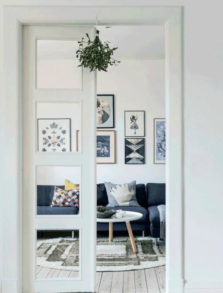 minimalistic white scandinavian interior with mistletoe