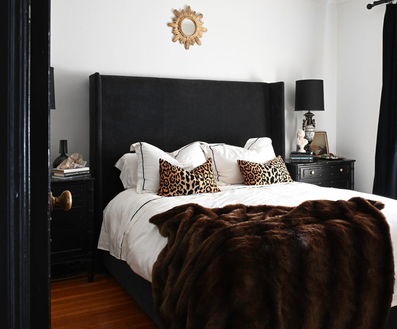 Hollywood Regency bedroom with black and gold accents