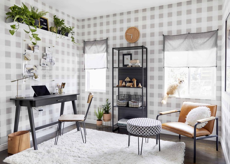 black and white home office with industrial style furniture and gingham print wallpaper