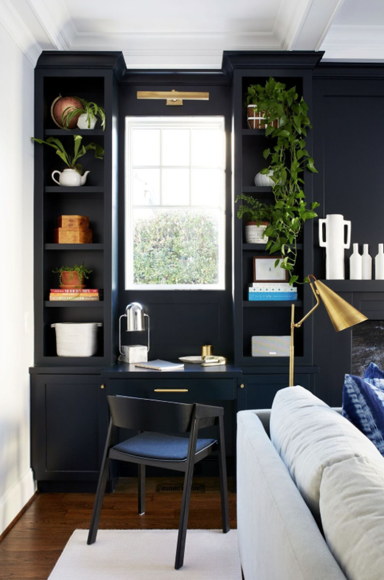 black and white home office with desk and built in shelves