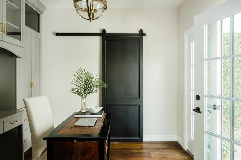 Home Office Doors with Black barn door in home office by Lauren Haskett Fine Design