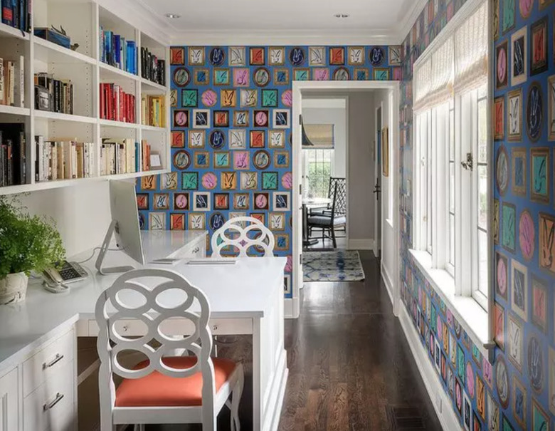 Home Office for Two White built in face to face desk with book shelves and wallpaper.