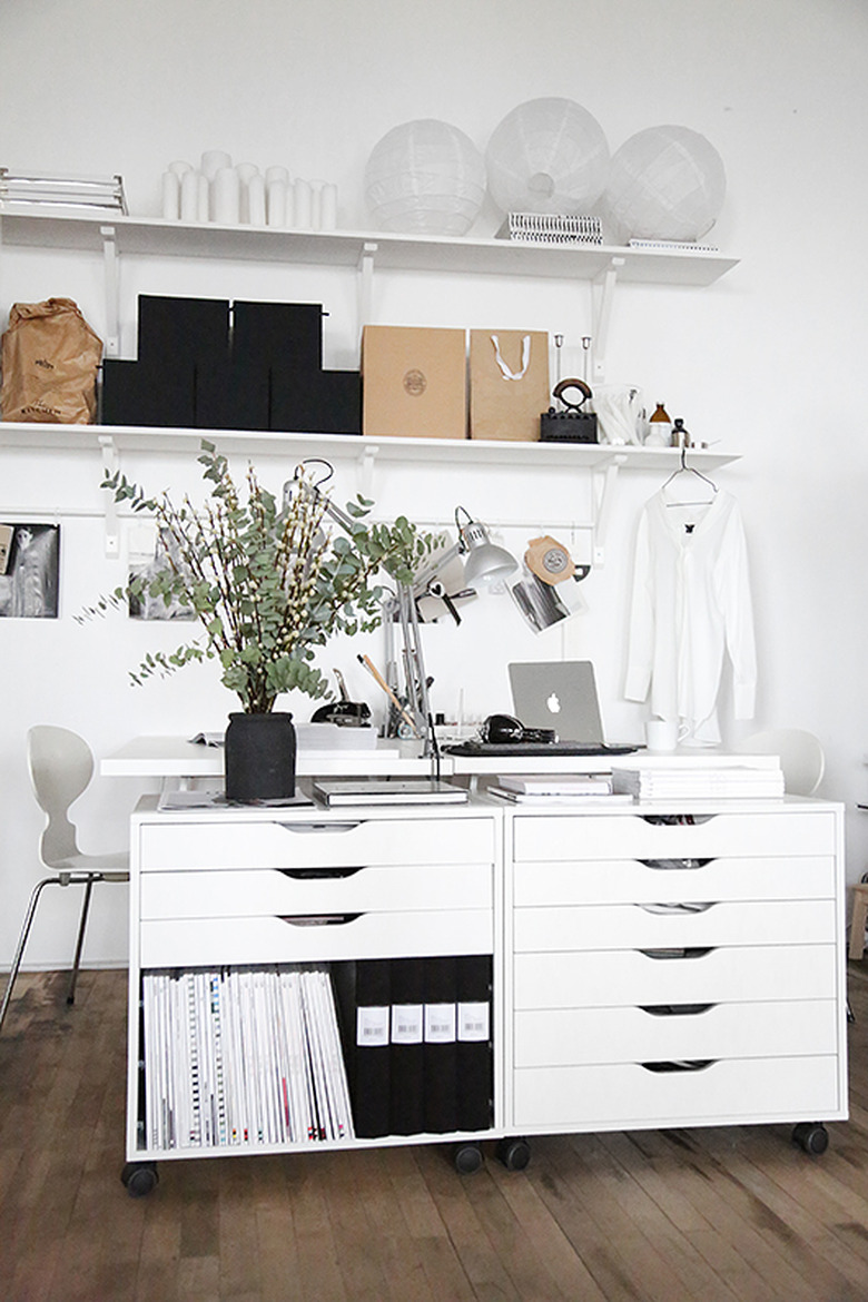 Home Office for Two White file drawers, face to face desks, shelves.