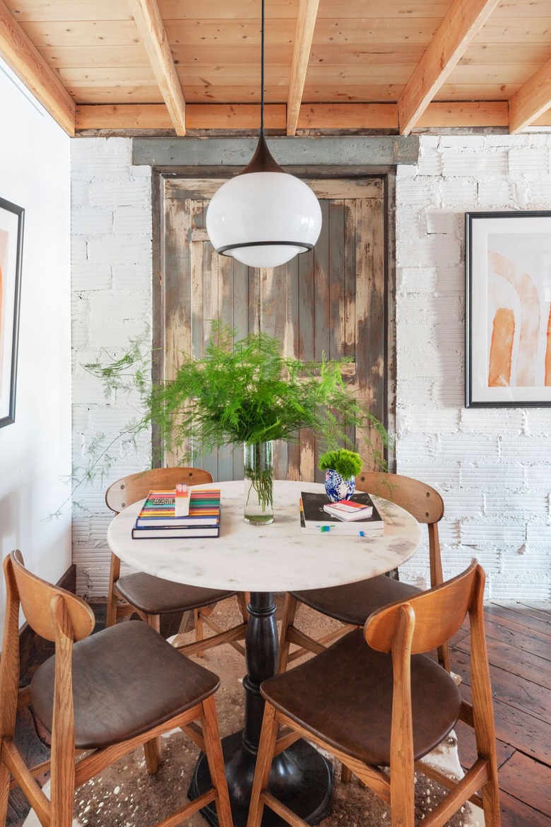 black and white modern pendant light in home office with wood accents