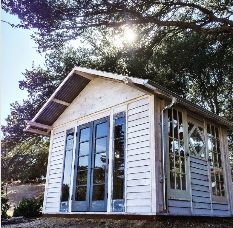 white Home office shed made of reclaimed wood