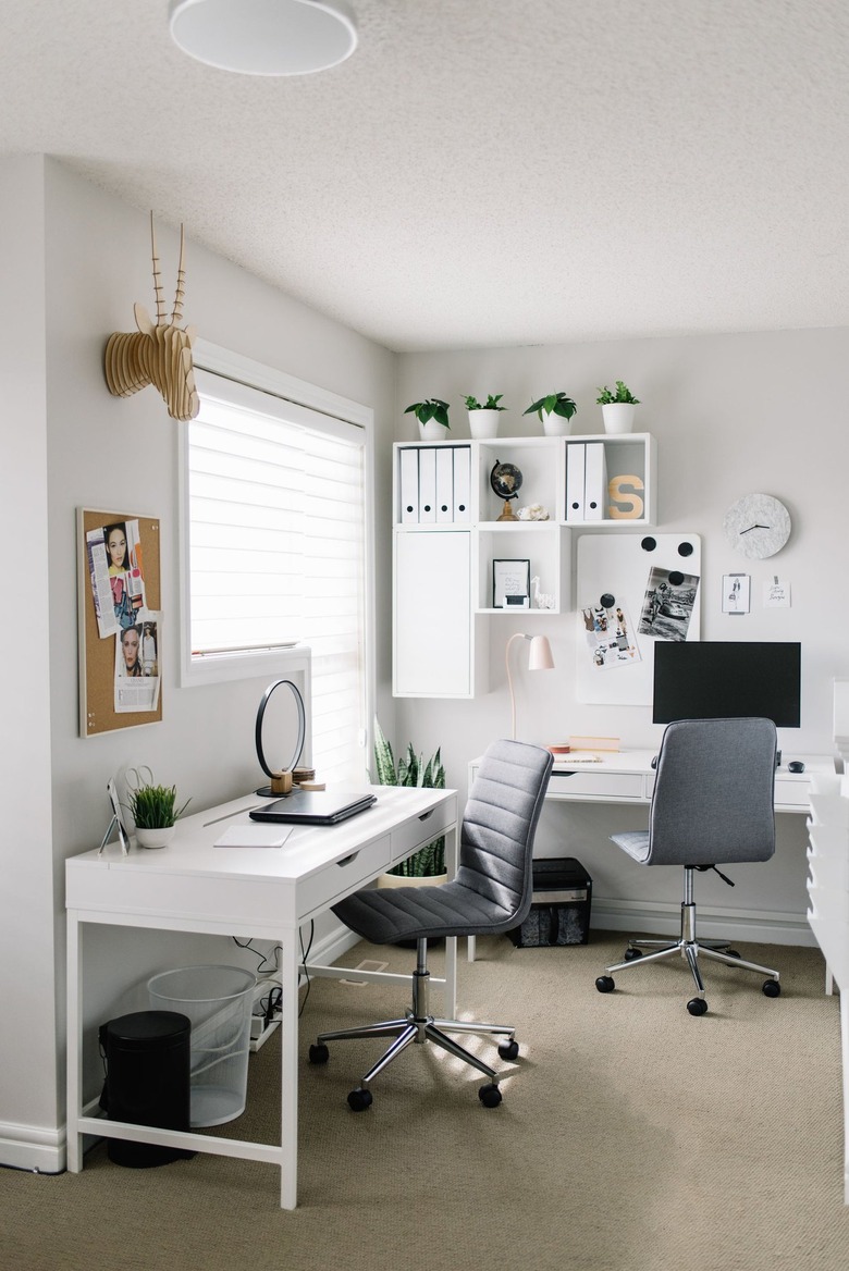 modern home office with white wall shelf and minimalist decor