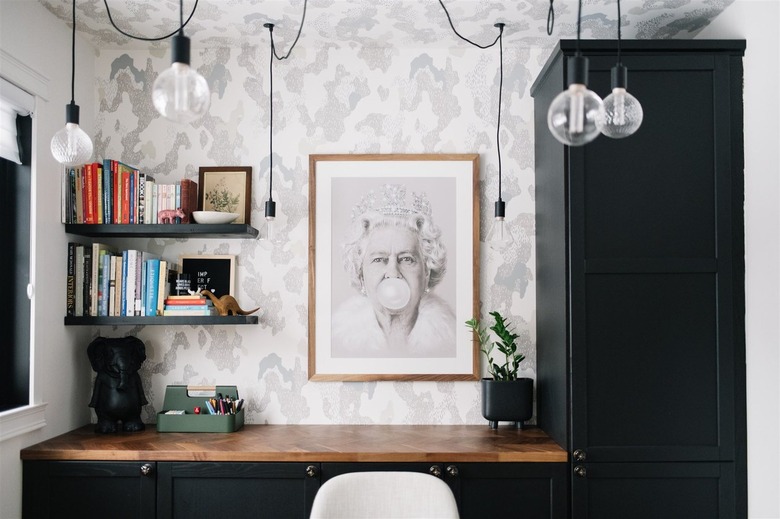 black floating shelves in corner of black and white modern office