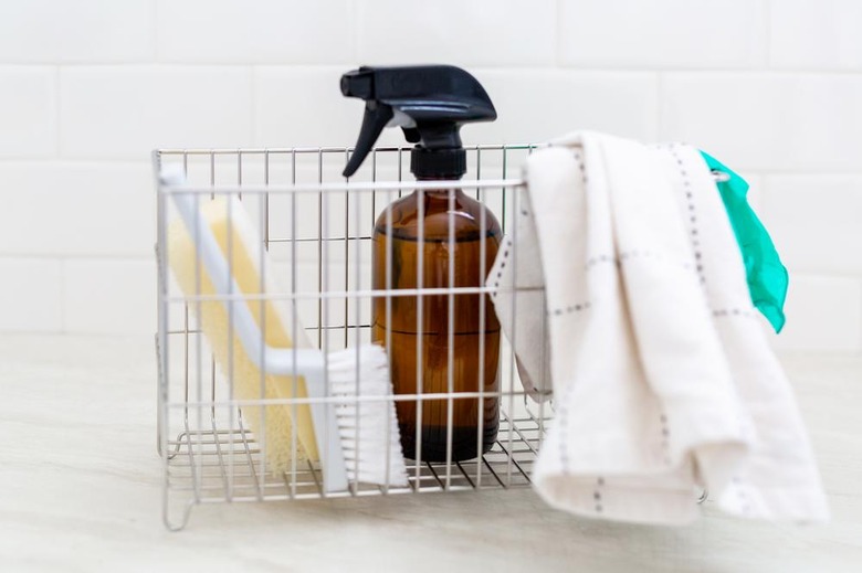 House Cleaning Ideas with a cleaning basket with cleaning products