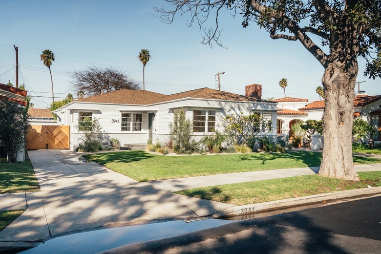 gray house with brown roof