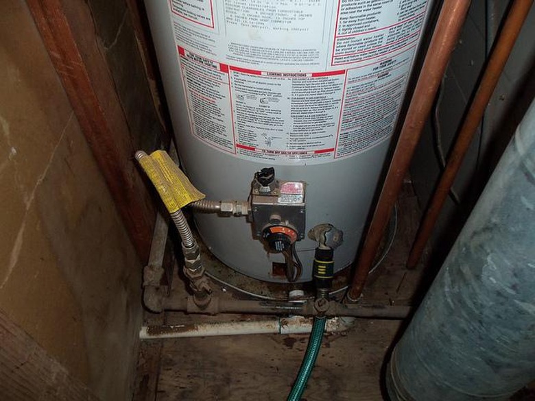 Draining a water heater.