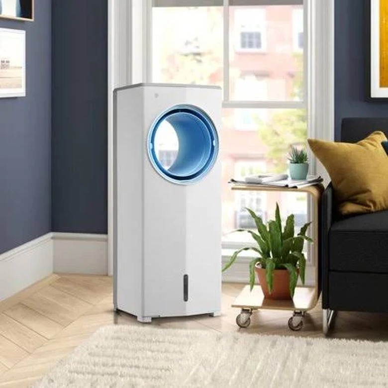 A white portable evaporative cooler in a living room