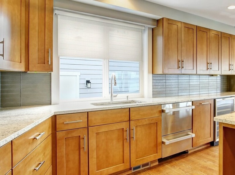 White roller blind in kitchen window.