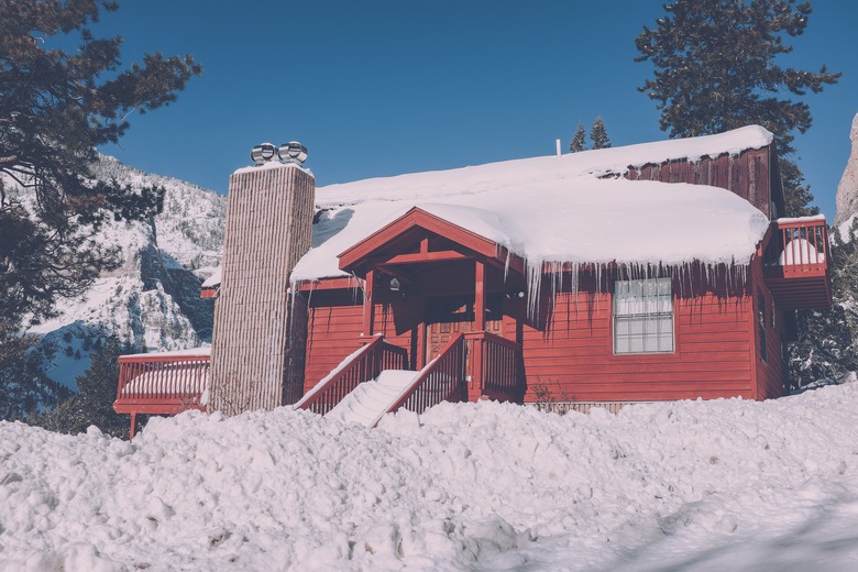 Roof laden with snow and icicles.