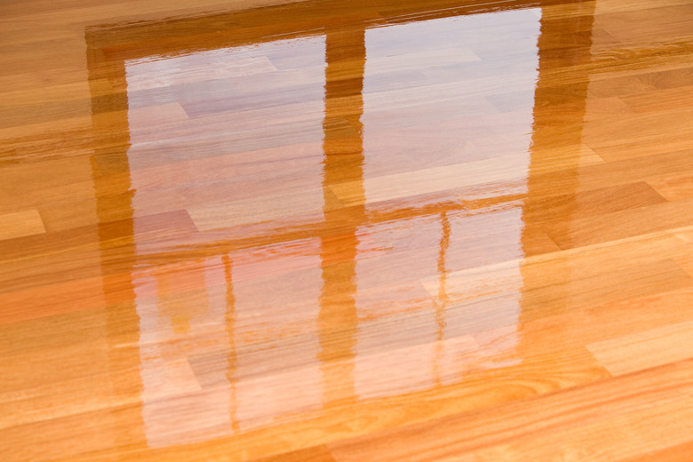 Wet Polyurethane on New Hardwood Floor With Window Reflection