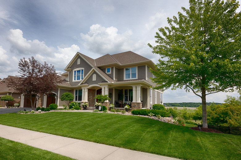 Suburban house with expansive lawn.