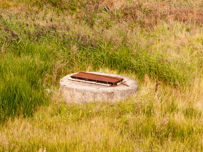 sewer bunker grate top in field country