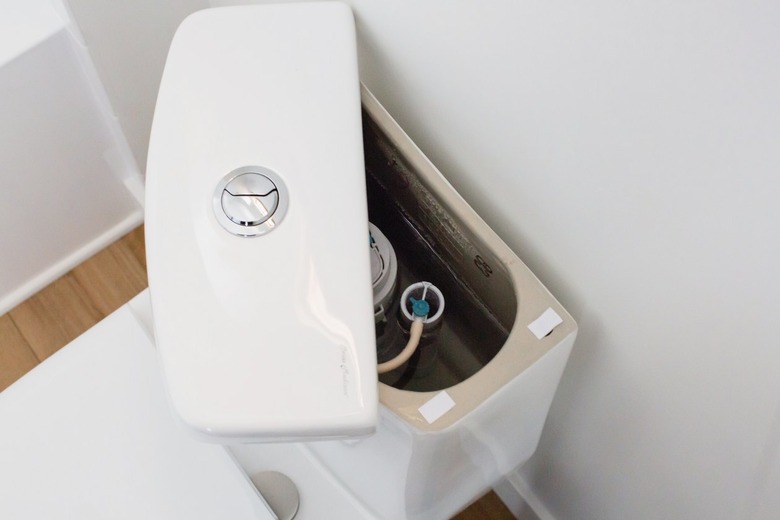 An open top of a toilet tank.