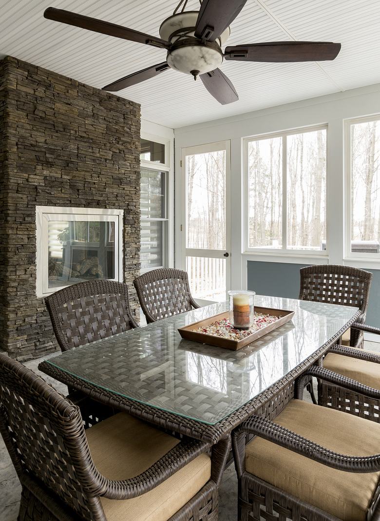 Wicker dining table and chairs in dining room.