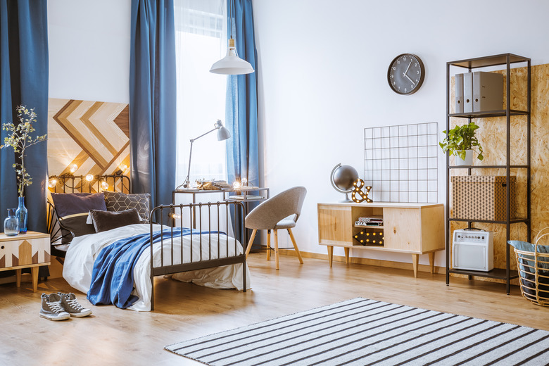 Bright, white bedroom with blue accents.