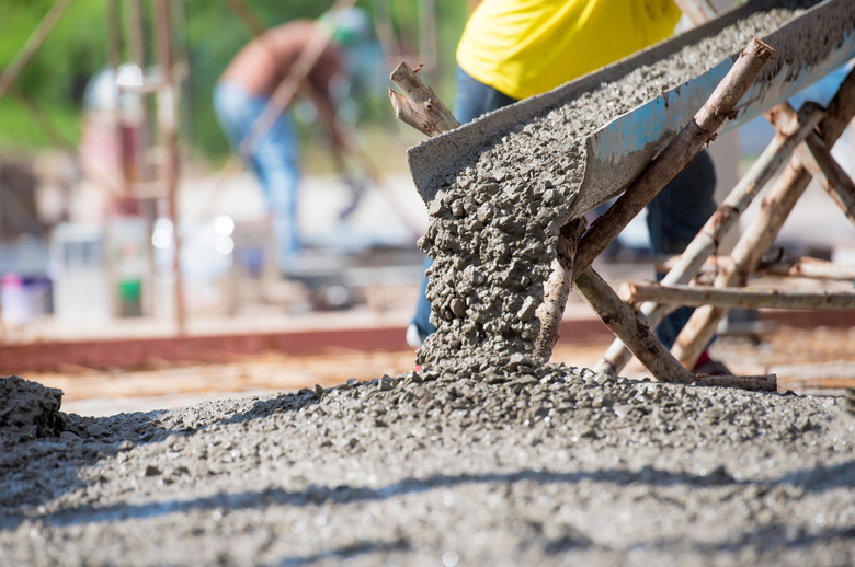 Concrete pouring during commercial concreting floors of building