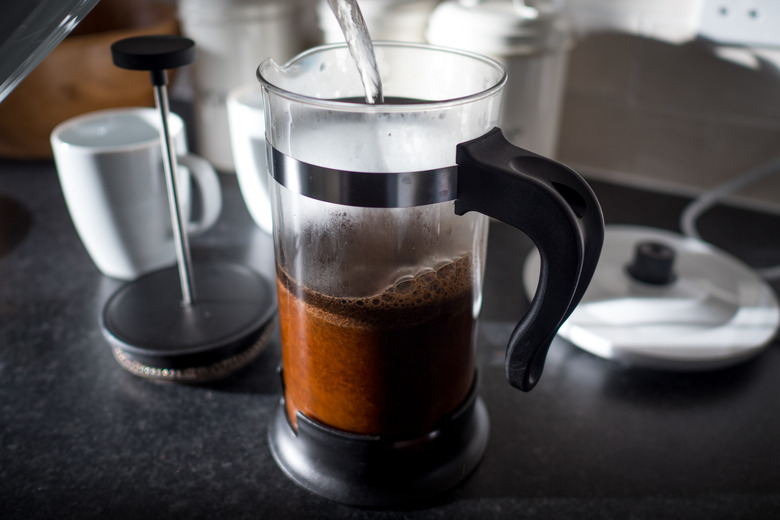 Hot water pouring into a French press coffee maker