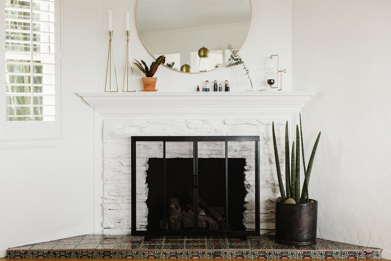 White brick fireplace with plant