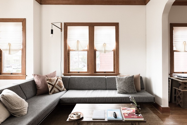 grey couch and cushions in a minimalist living room