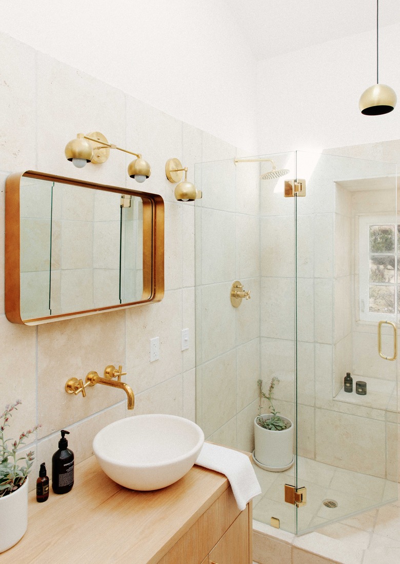 Modern bathroom with brass fixtures