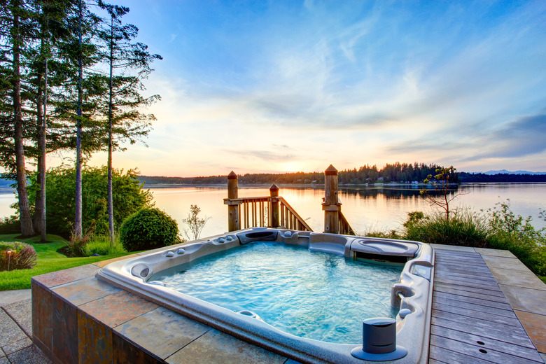 Awesome water view with hot tub in summer evening.