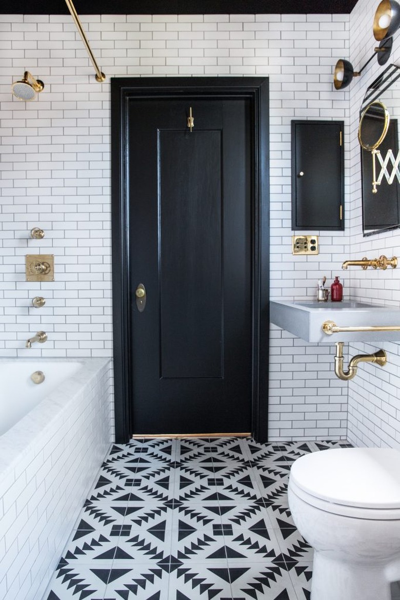 black and white bathroom with patterned floor tile