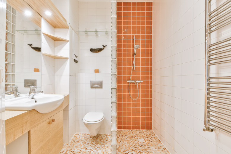 Modern bathroom with shower and sink.