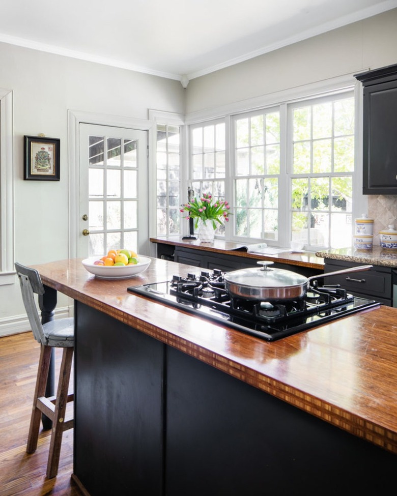 rustic kitchen black cabinets with wood countertop