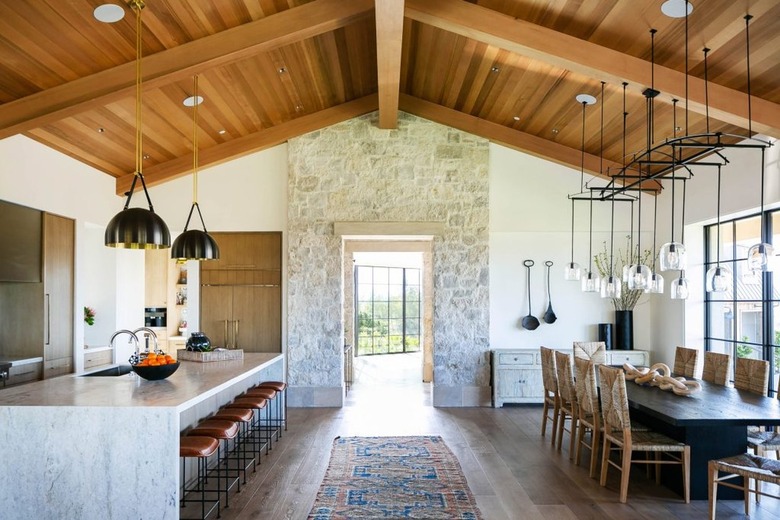 rustic kitchen with a stone wall