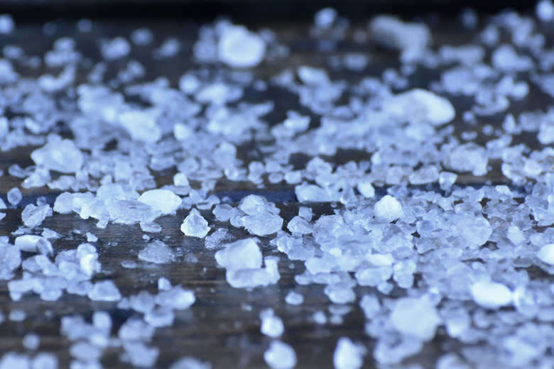 Road Rock Salt on Wooden Stair Step Close Up Abstract