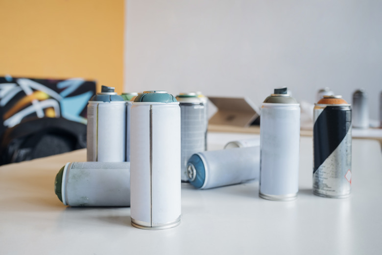 Aerosol spray paint can on table in studio