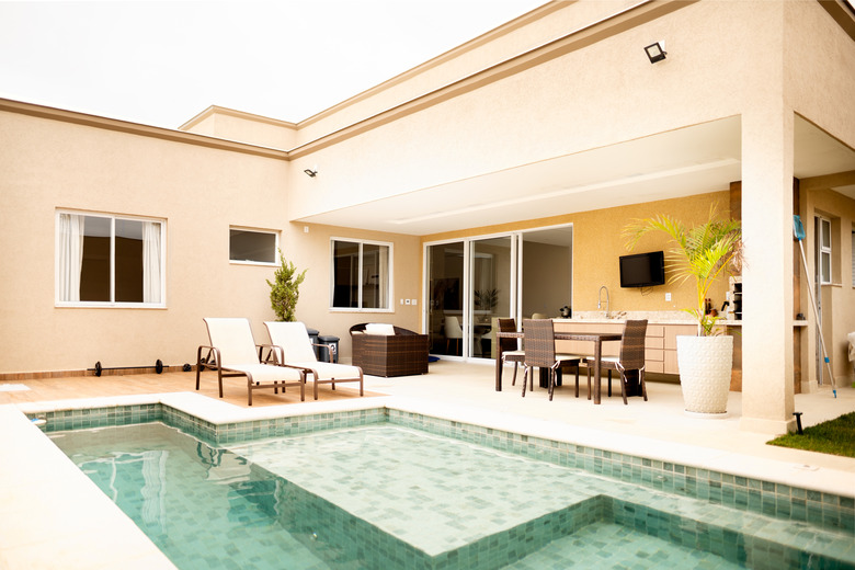 Stylish outdoor pool and patio area of a modern home.