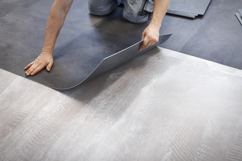 Worker making vinyl flooring