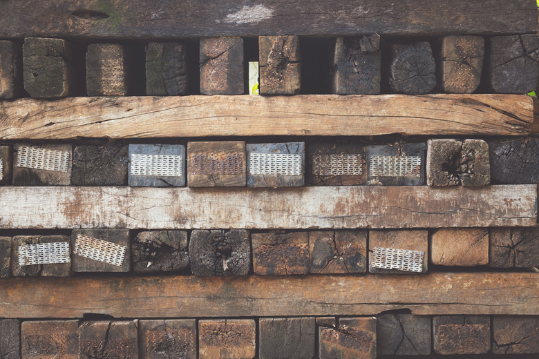 Many old railroad ties or wooden sleepers stack background