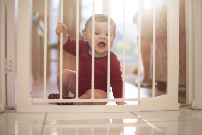 Baby boy upset at baby gate