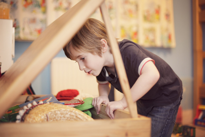 Young boy looking for toys