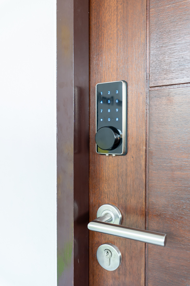 Electronic door lock security systems with key pads open by password number.