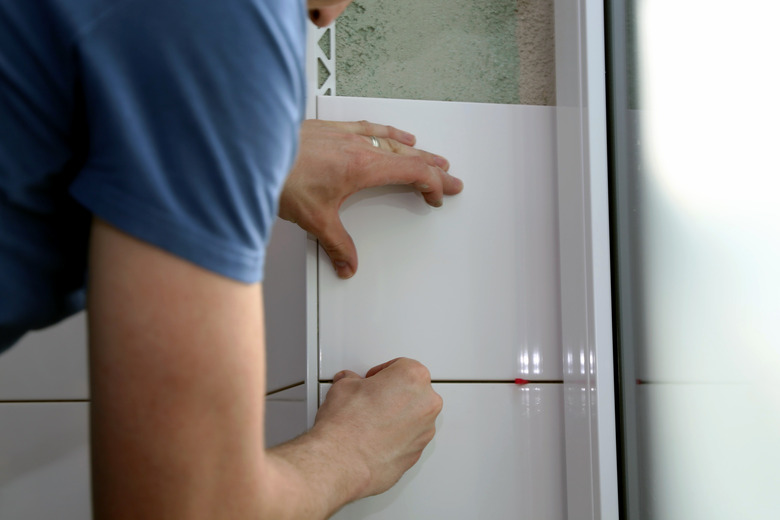 Installing wall tiles in a bathroom