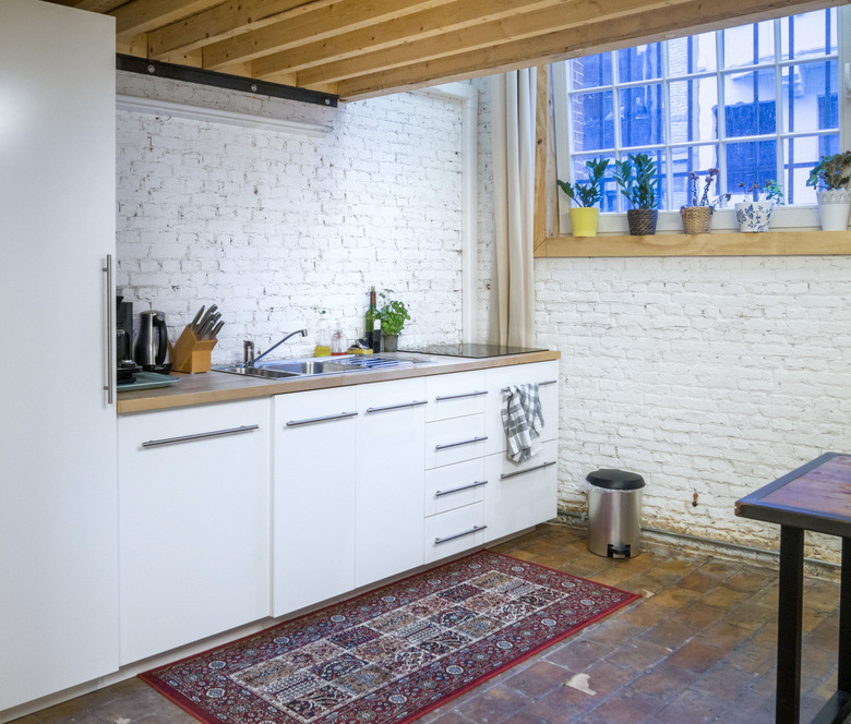 contemporary white kitchen in  loft