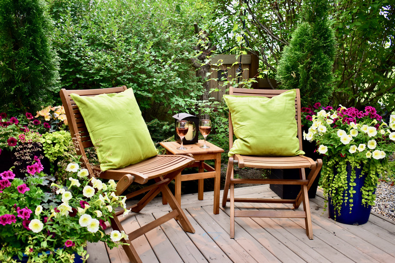 Sheltered outdoor garden patio oasis .