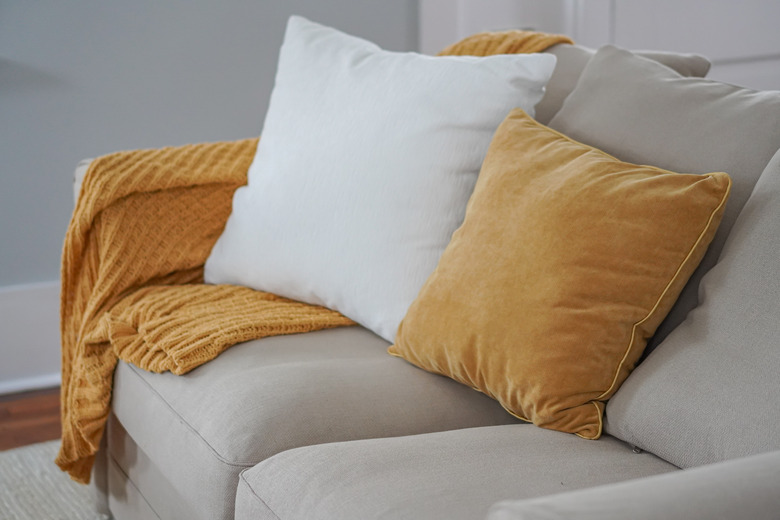 High Angle View Of Cushions On Sofa At Home